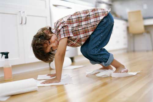 Boy helping his mom with spring cleaning