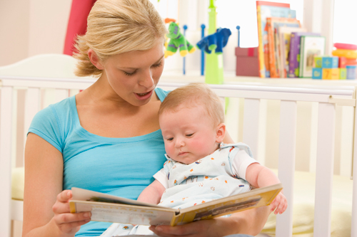Mom reading to her baby