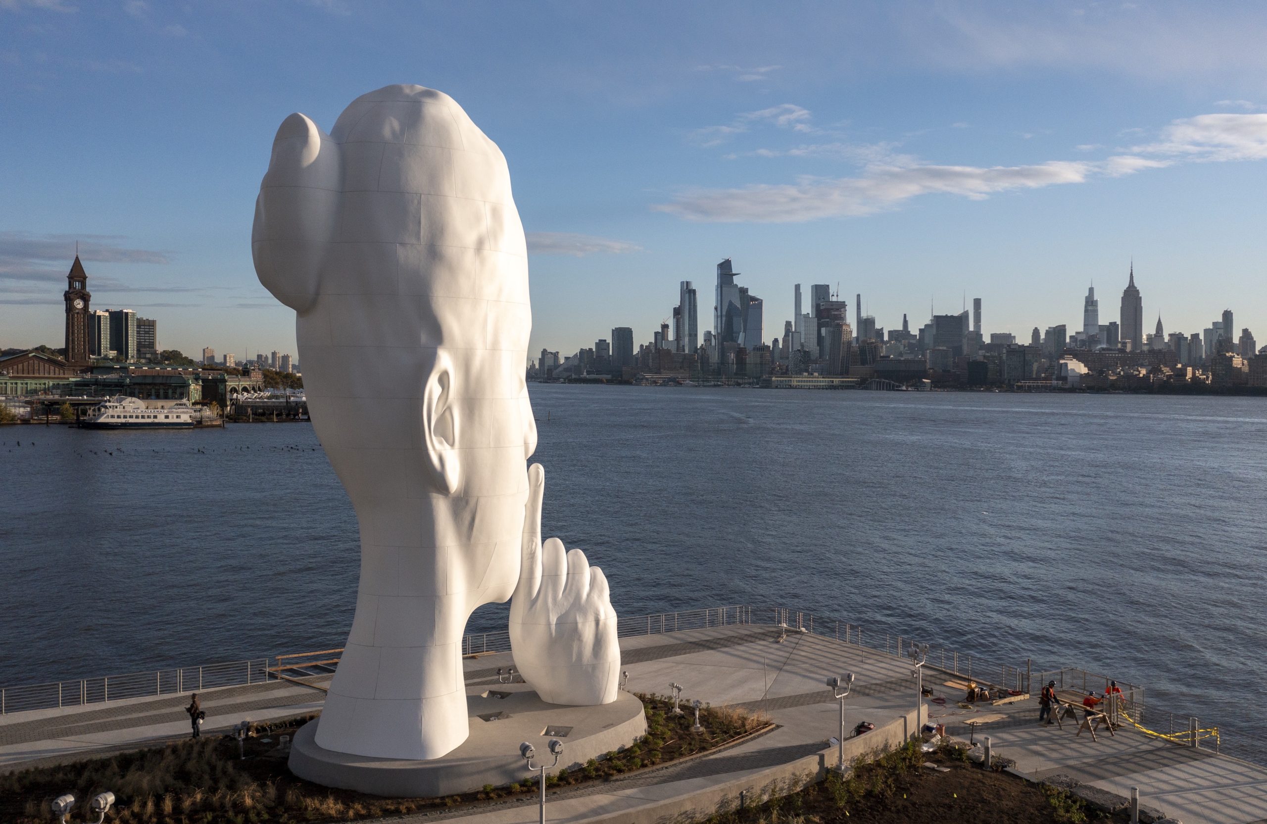 Statue of woman's head in Jersey City seen from Hudson River