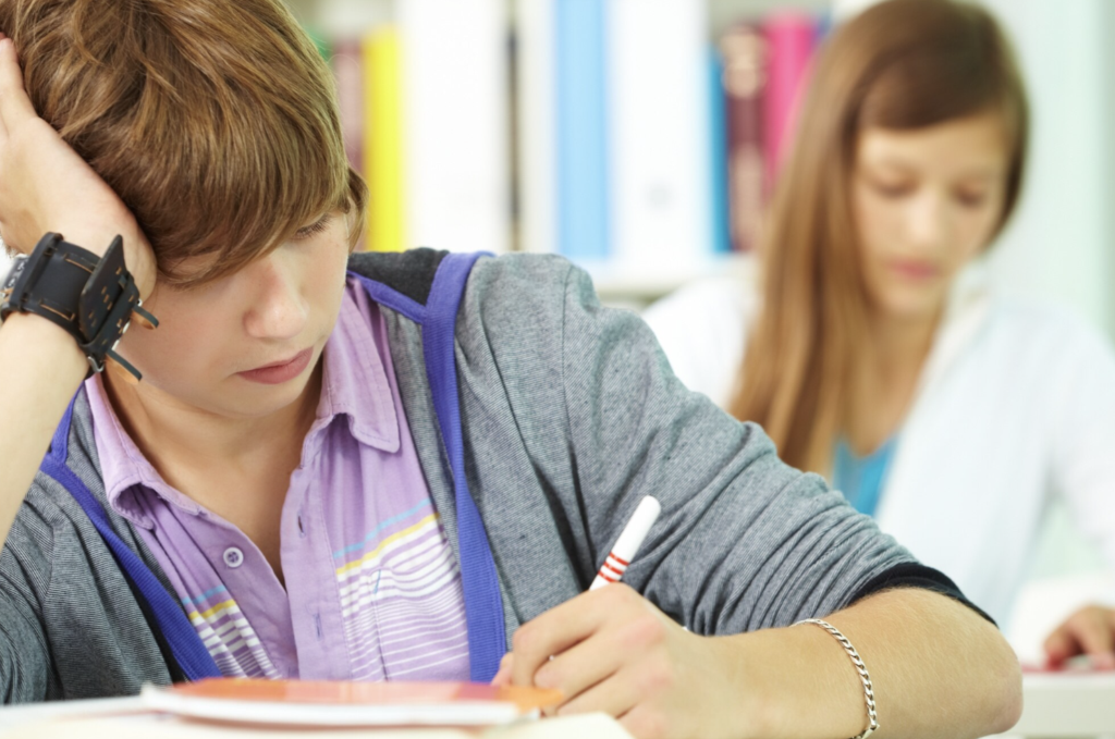 Teen studying and stressed about SAT and college applications